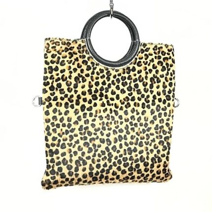 Bolso de piel artesanal con pero y asas circulares para mujer