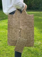 Bolso saco piel con efecto trenzado