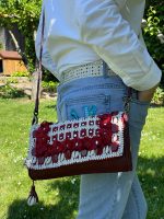 Bandolera de piel con concha