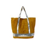 Bolso de piel con serraje y brillo estampado